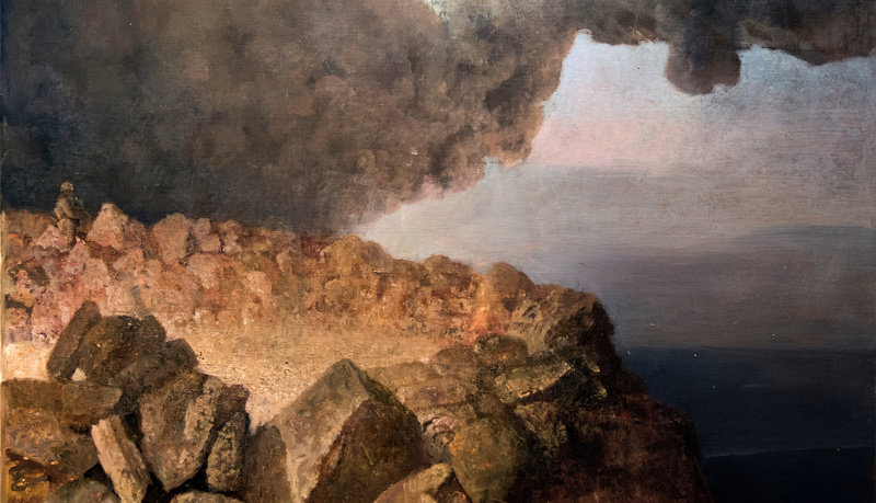 An oil on canvas painting by Vincent Desiderio that depicts a rocky seaside landscape. The cliff in the foreground is made of rocks of various shapes and sizes and is rendered in brown and beige. A solider kneels between the cliff rocks in the midground of the same color. The figure and cliff are set against a foreboding sky with a thick swirl of dark smoke cutting across it. 