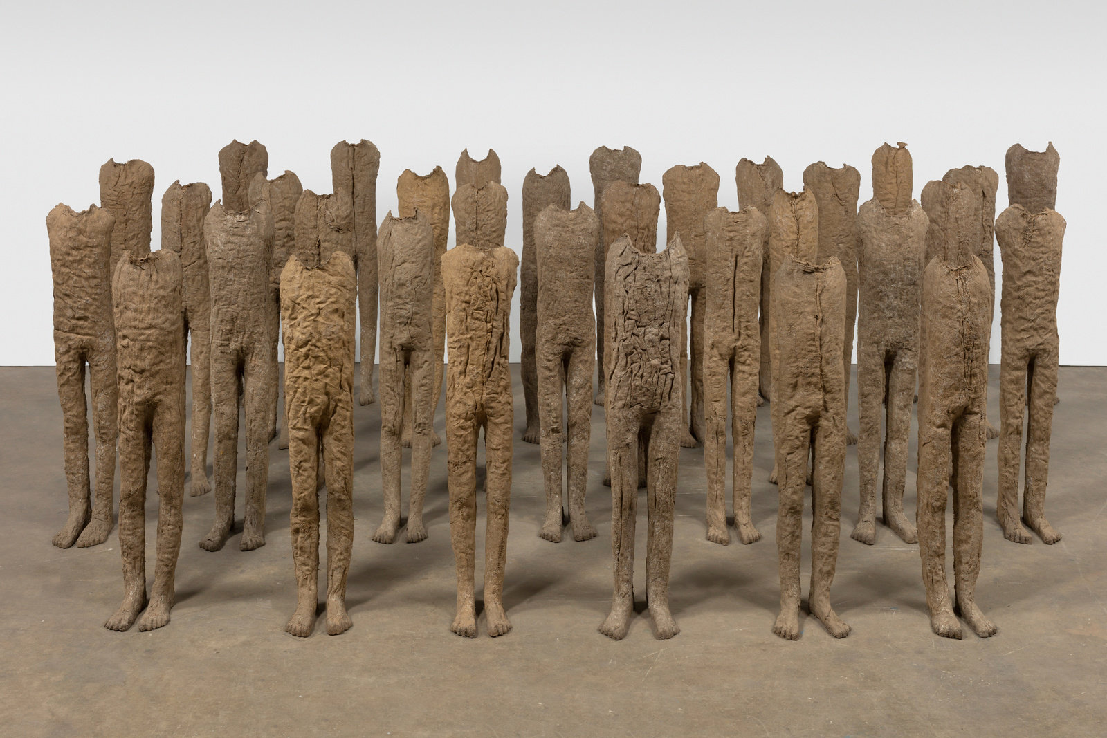 Abakanowicz, group infants (33 figures) (view 1), 1992, burlap and resin, each figure approx 55 1 8 x 11 1 2 x 11 3 4 in., 140 x 29.2 x 29.9 cm, non 32.725 lance brewer