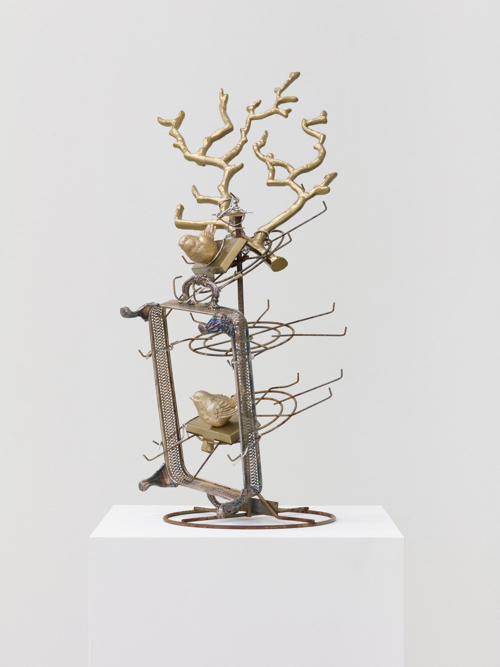 A sculpture by Joe Minter composed of metal objects and wire. 