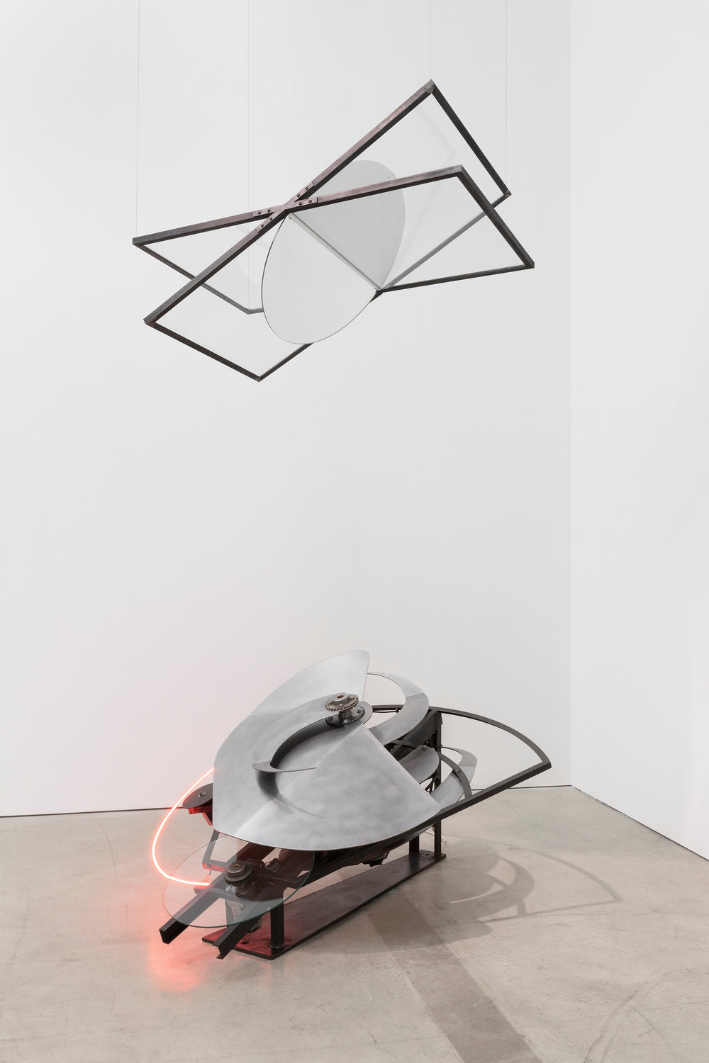 A kinetic sculpture with a neon strip by Alice Aycock
