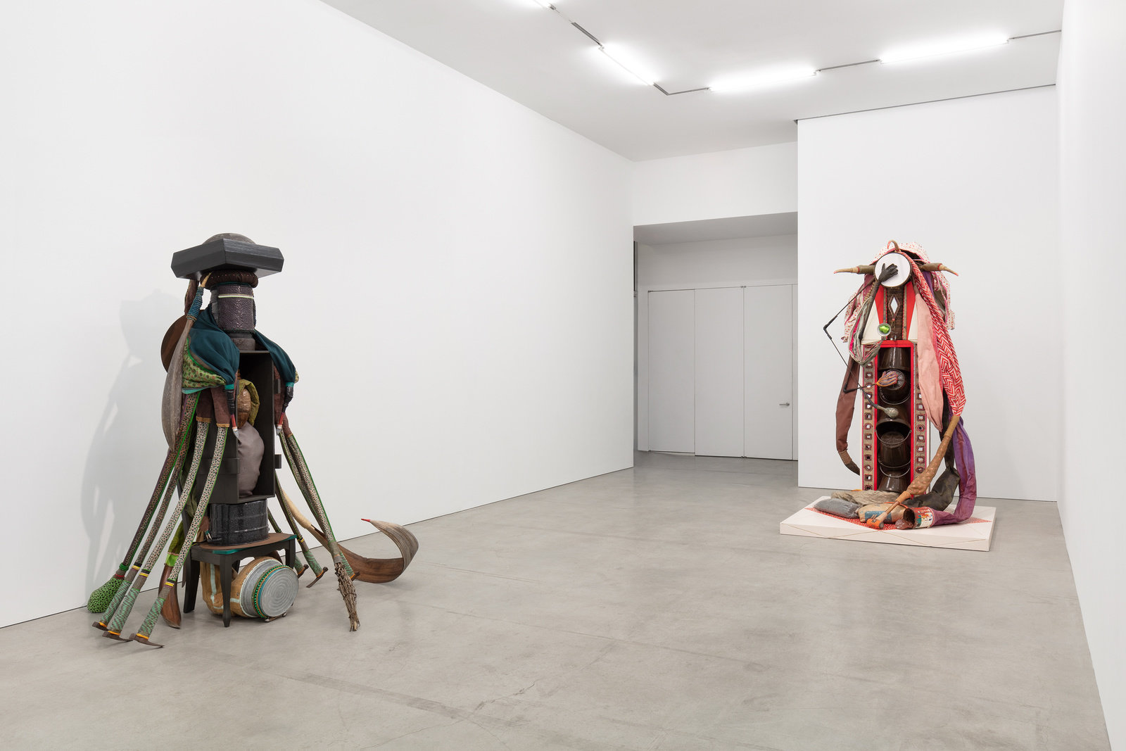 An installation view of two sculptures by Daniel Lind-Ramos. 