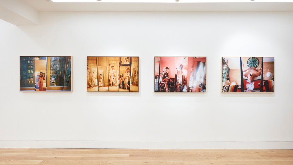 An installation view of four Ryan McGinley photographs hung horizontally on the wall. 