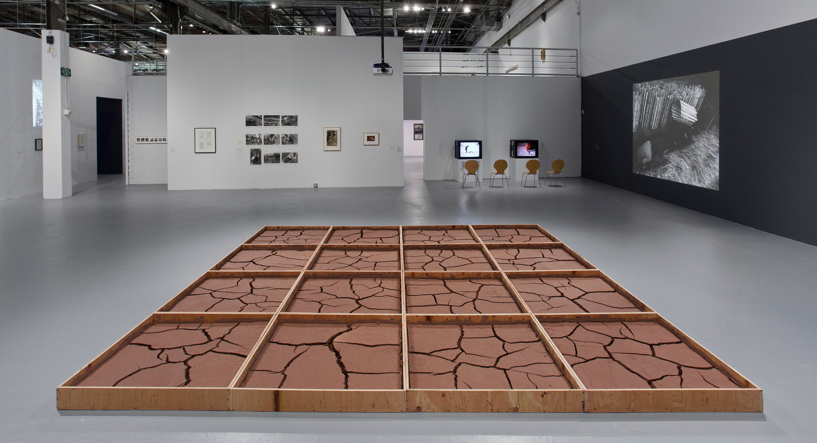 Aycock, clay no. 2, 1971, clay mixed with water in wood frame, 16 elements, 48 x 48 x 6 in. each, ed. 1 of 1